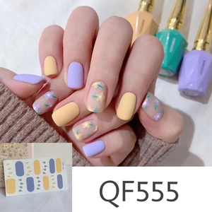 Detailed macro view of QF555 matte floral nail stickers in purple and yellow daisy patterns