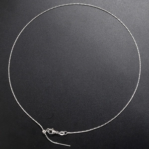 Detail of silver snake bone necklace featuring a secure lobster clasp and adjustable chain