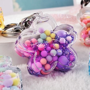 Acrylic flower oil pendant keychain with colorful macaron beads and purple glitter