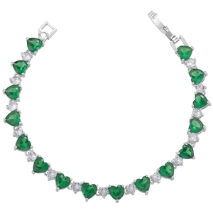Macro view of silver plated bracelet with green heart zirconia and sparkling crystal stones