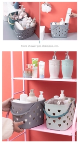 Detailed view of heart-patterned bathroom storage baskets for toiletries on a vanity