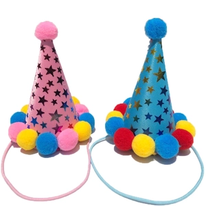 Pink and blue sparkly pet birthday party hats with star patterns and colorful pom-poms