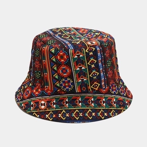 Detailed view of reversible sun bucket hat with colorful tribal geometric patterns