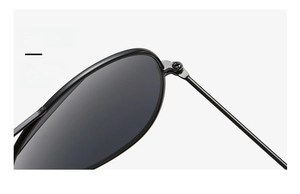 Detail of durable metal hinges and screw reinforcement on kids' aviator sunglasses