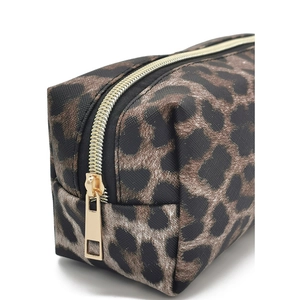 Detail of leopard print makeup bag showing textured fabric and premium gold zipper