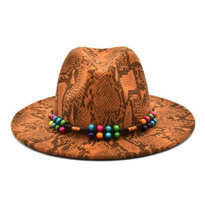 Detail of wide brim fedora with brown snakeskin pattern and colorful bohemian bead band