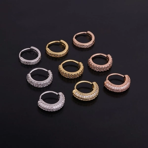 Macro shot of 9 zirconia cartilage hoops in silver, gold, and rose gold finishes