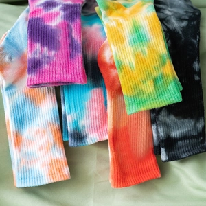 Tie-dye crew socks in six vibrant color gradients, featuring soft ribbed cotton blend