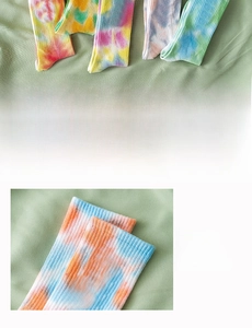 Detail display of tie-dye crew socks featuring a ribbed cuff and soft knit texture