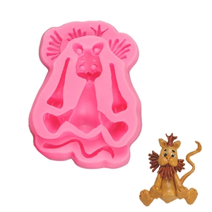 Detailed pink silicone mold for lion-shaped fondant with a finished resin model example