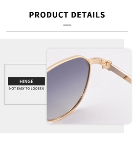 Detail of reinforced metal hinge on polygon sunglasses showing precision welding