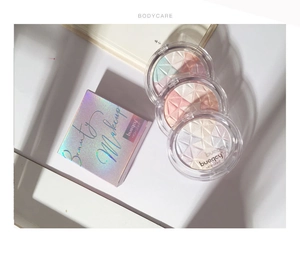 Macro detail of three multi-color mosaic highlighter palettes with holographic packaging