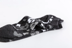 Close-up of camouflage pattern socks in dark grey, black and white color scheme