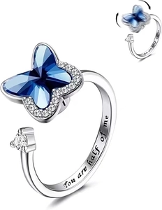 Detail of spinning blue crystal butterfly ring with You are half of me engraving