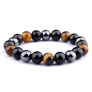 Macro detail of 8mm hematite, obsidian, and tiger eye beads on an elastic energy bracelet