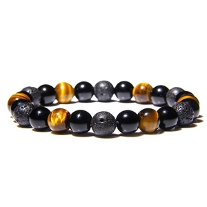 Macro detail of 8mm tiger eye, obsidian, and porous lava stone beads on stretch cord