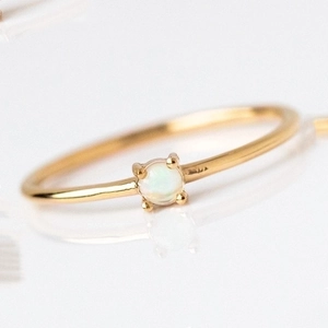 Elegant 18k gold plated slim ring with a four-prong set round white opal stone