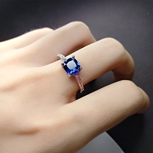 Elegant silver ring with a square blue gemstone in a four-prong setting for women