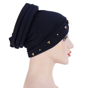 Navy blue pleated turban hat for women with elegant gold bead decorative accents