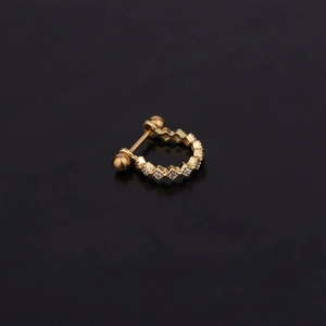 U-shaped gold stainless steel stud earrings with micro-pave cubic zirconia on black background