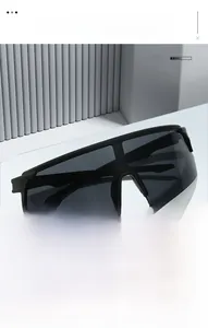 Detail view of the black matte frame and wide integrated grey lens of sports sunglasses
