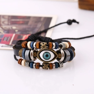 Detail of vintage evil eye beaded leather bracelet with adjustable woven cords