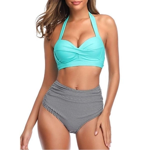Detail of mint green halter bikini top with twist knot and high waist striped bottom
