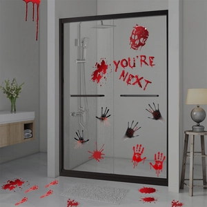 Halloween blood splatter and bloody handprint decals on glass door and tiled floor