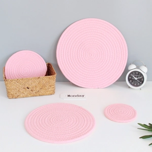 Detail of pink cotton rope woven coasters in four sizes for heat resistant table protection