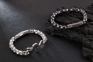 Detailed view of vintage stainless steel skull bracelets with rugged industrial chain links