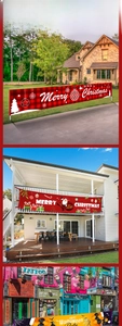 Close-up of festive plaid Merry Christmas and Happy Halloween outdoor hanging banners
