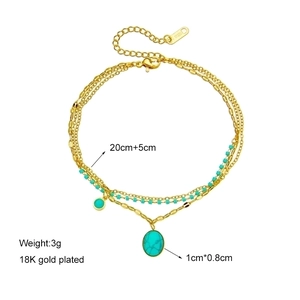 Bohemian gold chain bracelet with turquoise oval pendant and 18K gold plating detail