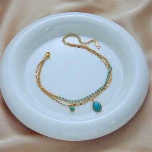 Bohemian gold stainless steel double layer bracelet with oval turquoise charm on silk