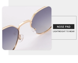 Detailed close-up of soft silicone nose pads on retro metal polygon sunglasses