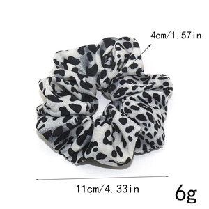 Elastic leopard print scrunchie in black and white tones with 11cm diameter measurement