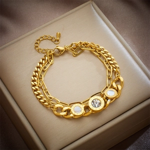 Golden double chain bracelet with Roman numeral pendants and sparkling crystal inlay