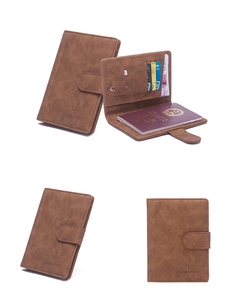 Brown leather passport wallet interior with card slots, SIM holder, and ejector pin tool
