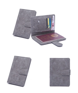 Macro view showing internal card slots, SIM slots, and snap closure of the grey RFID passport holder