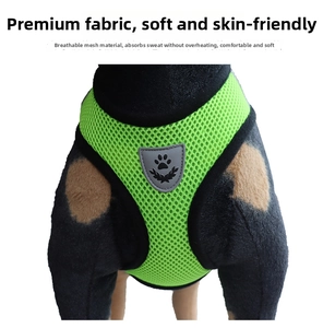 Detail of lime green breathable mesh pet harness featuring a shield footprint logo