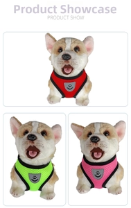 Close-up of mesh pet harness in red, green, and pink with reflective paw print logo details