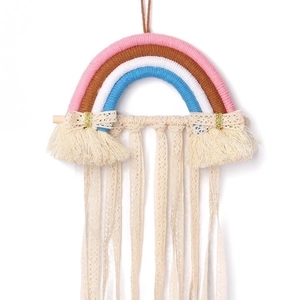 Rainbow woven wall hanging hair clip organizer with cream tassels and golden bows