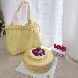 Detailed view of yellow canvas drawstring tote bag in a bright birthday party setting