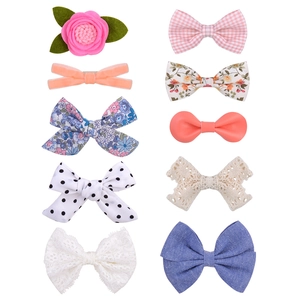 Set of 10 assorted boutique bow hair clips for girls in various colorful patterns