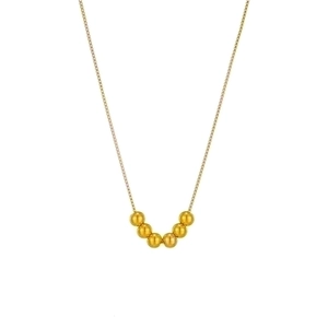 Minimalist gold titanium steel chain necklace featuring seven round beads on white background