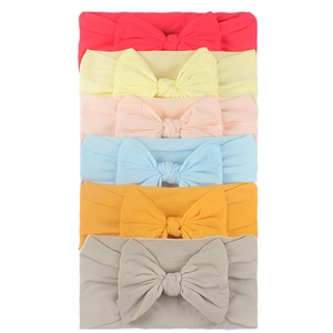 Set of 6 soft nylon baby headbands with large bows in various pastel and vibrant colors