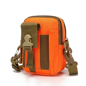 Detail view of bright orange tactical waist bag with green webbing and plastic buckles