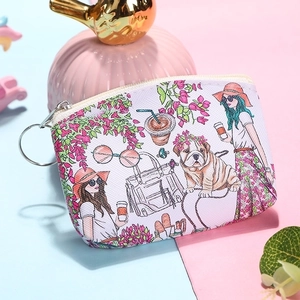 Detail of white PU leather coin purse with fashion illustration, zipper, and key ring