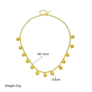 Layered gold stainless steel chain necklace featuring eleven polished 6mm bead charms