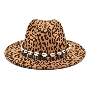 Detail of leopard print wool fedora with seashell bead band and striped ribbon accent