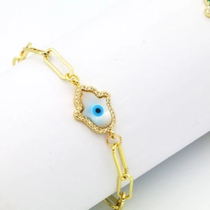 Gold paperclip bracelet featuring a Hamsa hand charm with mother of pearl and evil eye